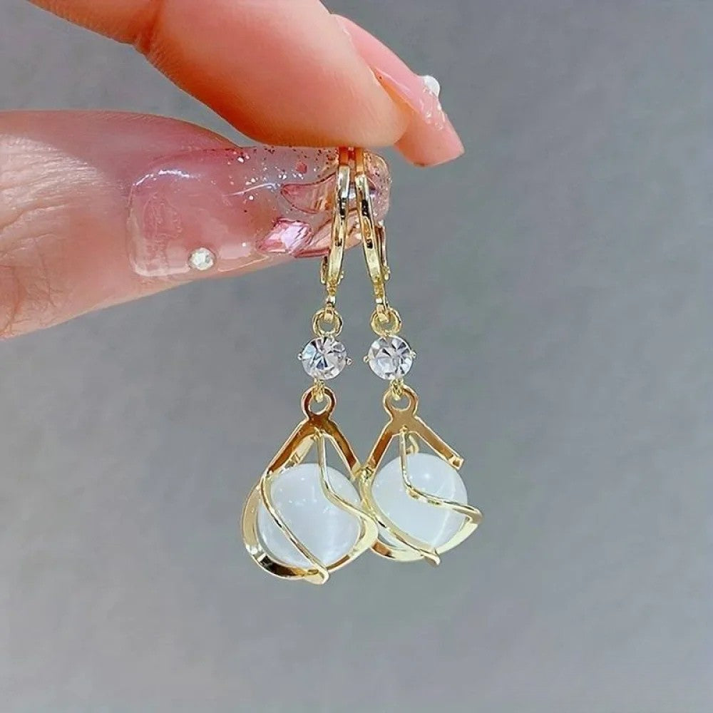 Boucles d'oreilles pendantes en or opale blanc antique