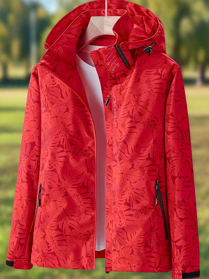 Giacca impermeabile da donna con cappuccio e stampa di foglie botaniche