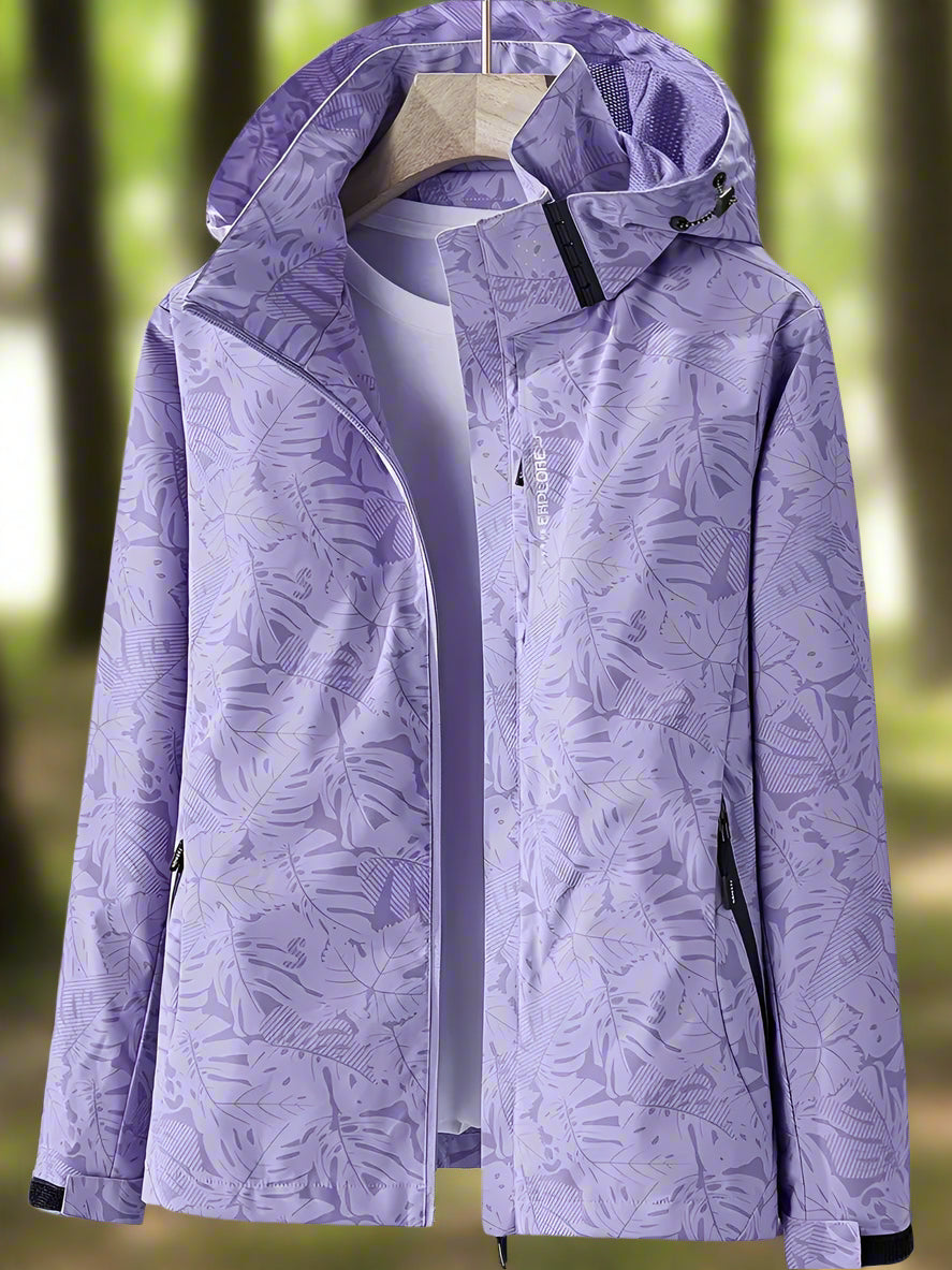 Giacca impermeabile da donna con cappuccio e stampa di foglie botaniche