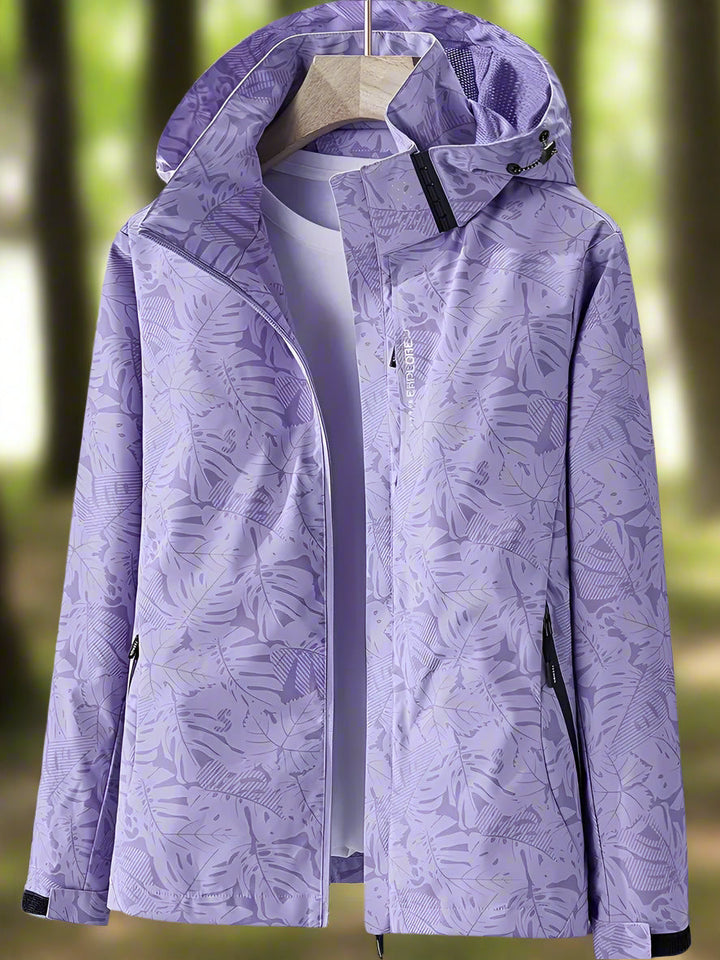 Giacca impermeabile da donna con cappuccio e stampa di foglie botaniche